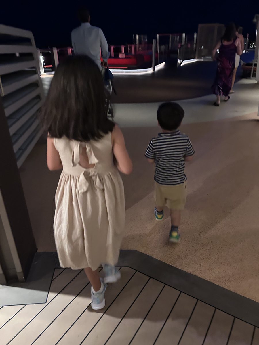 Two kids heading out together on a family outing